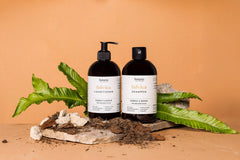 Fulvica Shampoo und Conditioner auf einer Steinplatte