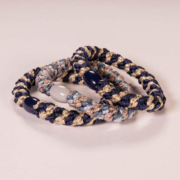 Drei Haargummis in Blautönen